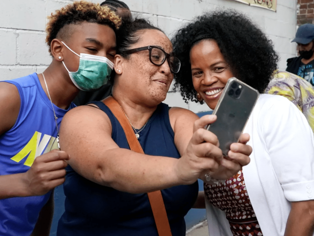 Mayor Kim Janey takes a selfie with several Bostonians during a Juneteenth celebration