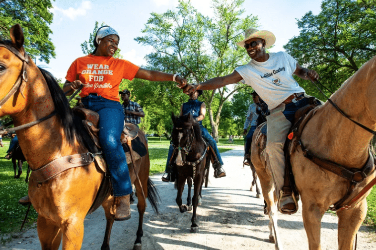 People celebrate last year’s Juneteenth by riding horses through Washington Park in Chicago