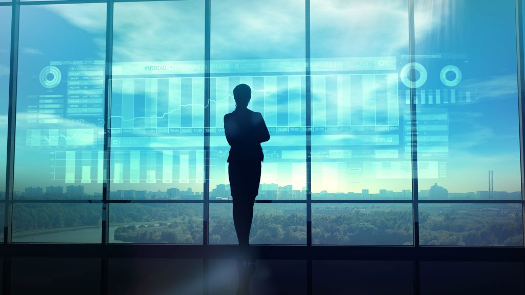 A CIAT student looking out through a window into the distance while pondering her data analytics concentration